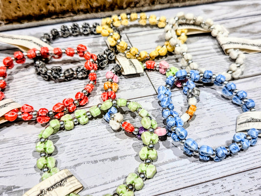 Snoopy beaded bracelet with mixed red, yellow, green, and blue round beads