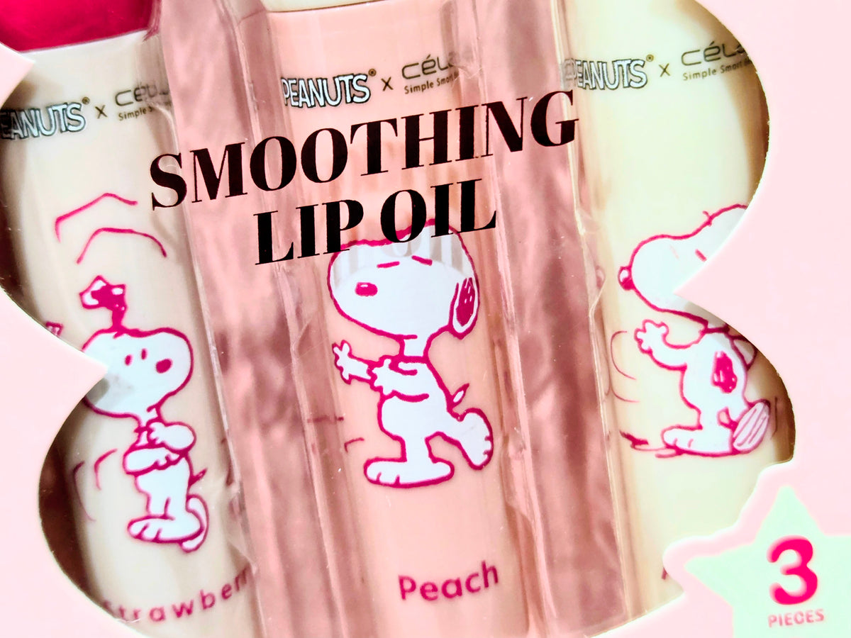 Pink PEANUTS smoothing lip oil pouch with peach Snoopy design