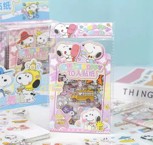 Pink Snoopy sticker pack on display with multiple sticker sheets visible nearby