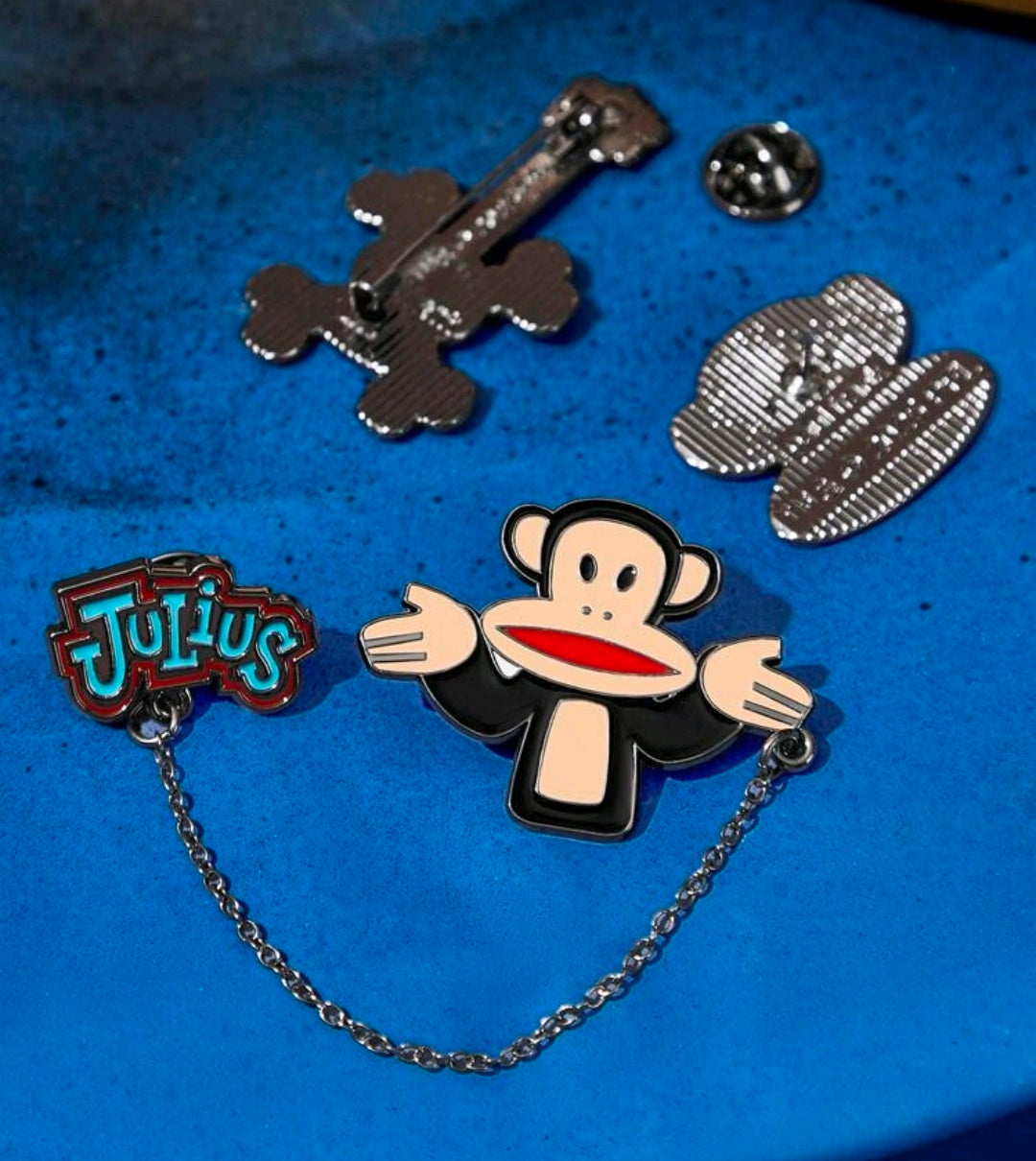 3-piece enamel pin set with Julius monkey, guitar, and Tutius logo pins
