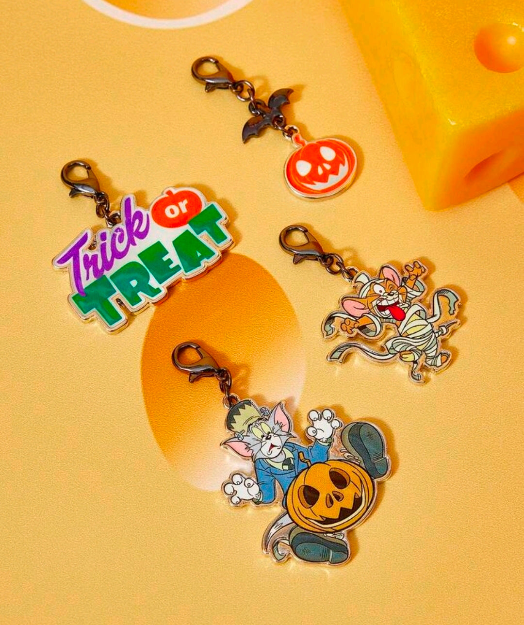 Set of 4 Halloween bag charm clips with Trick or Treat, pumpkin, and cartoon character charms