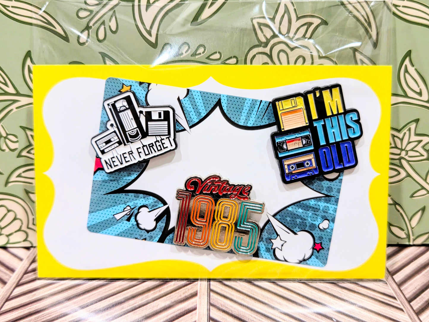 Enamel pins set on display card with 'I'm this old' and 'Vintage 1985' designs