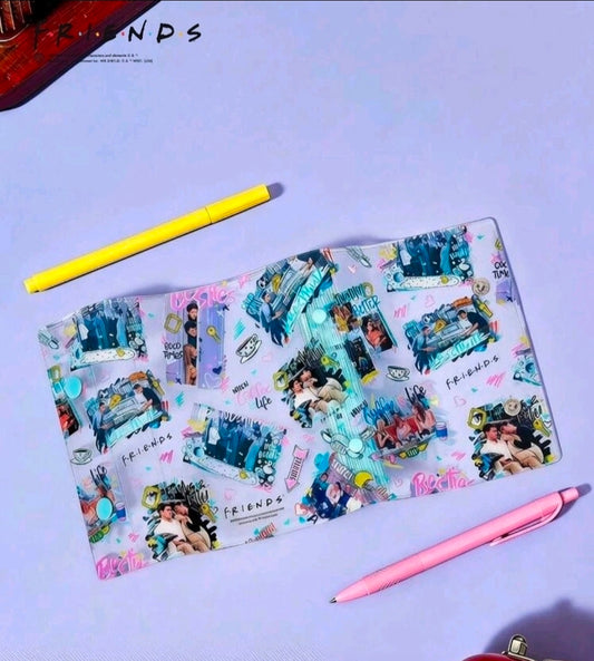 Flat view of blue collage sticker binder planner with two pens