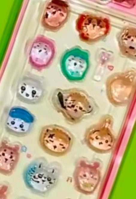 Mini gashapon sticker keychain with 3D character stickers in clear pink blister