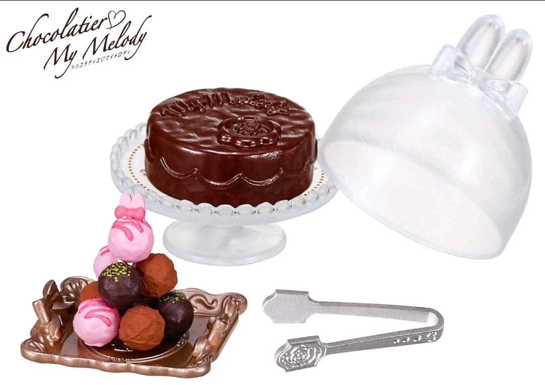 Chocolatier mini figure accessories with cake on stand, clear dome, chocolates, and small utensils