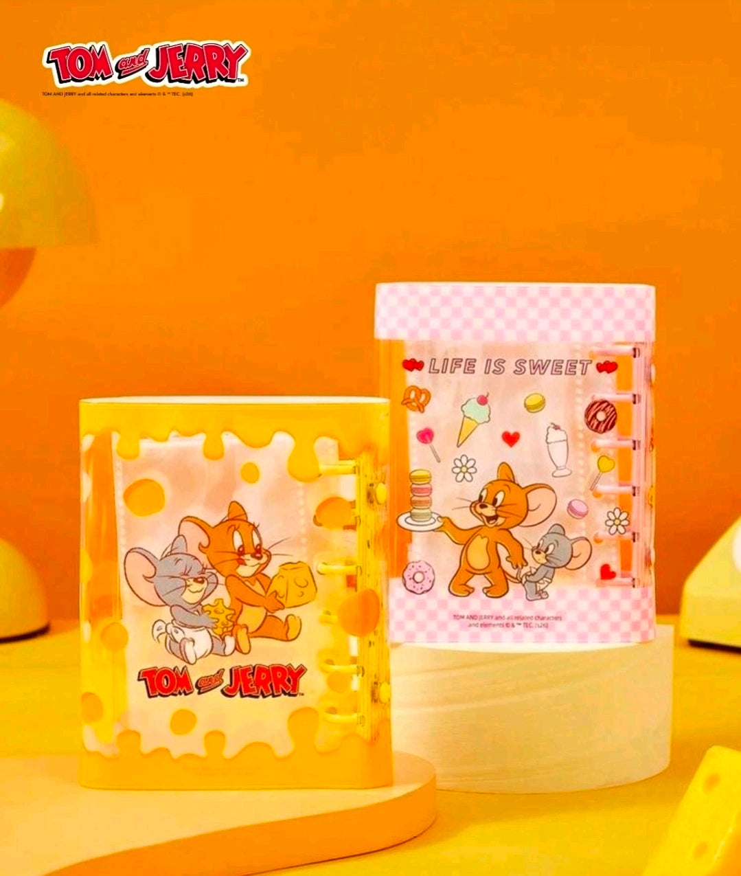 Yellow A7 sticker binder planner with pink heart cover and Tom & Jerry cartoon art
