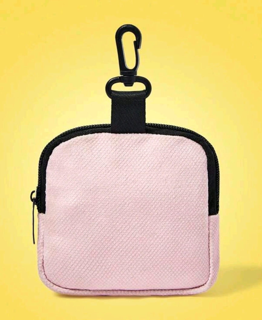 Pink textured mini zip coin pouch with black carabiner clip and zipper