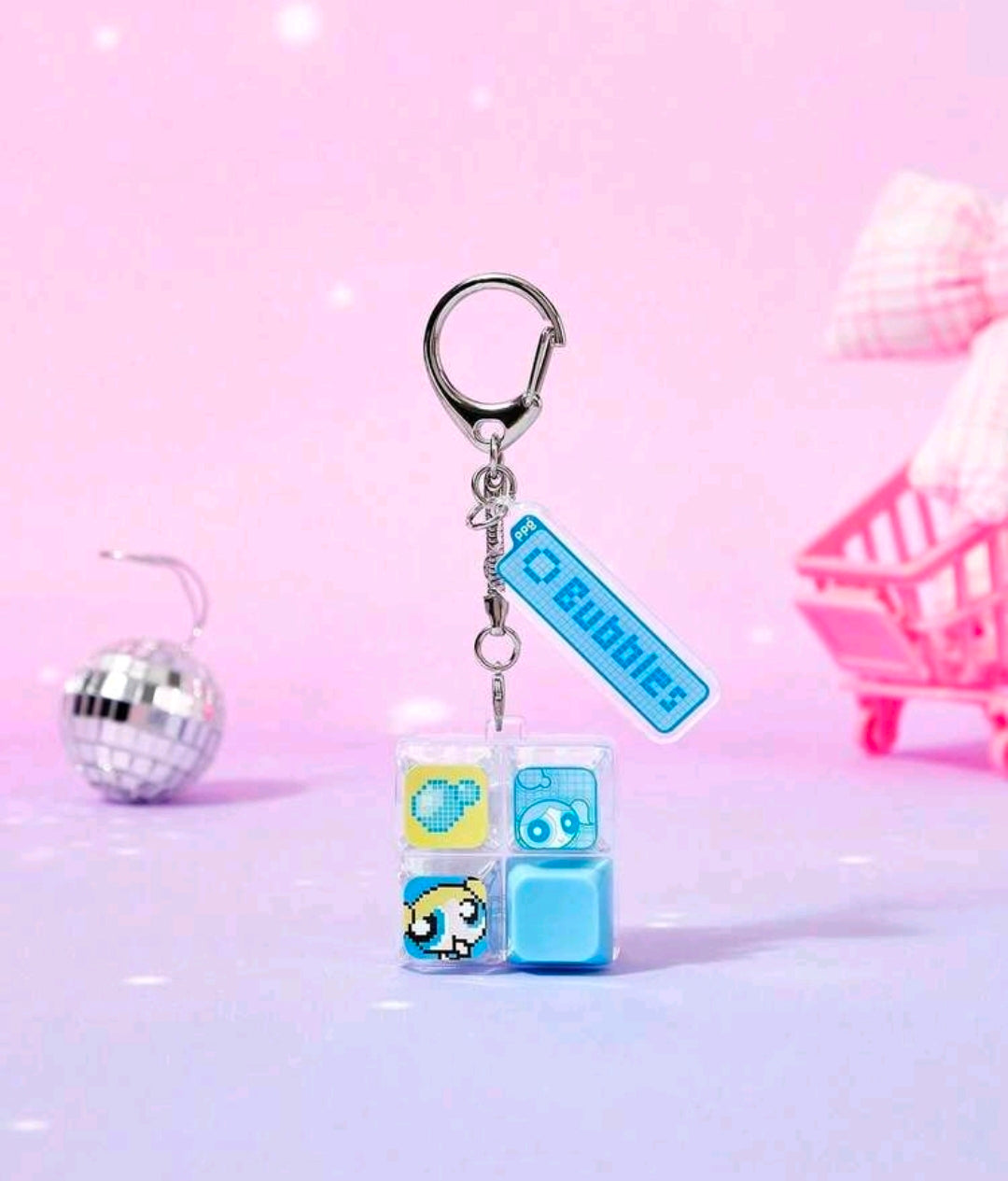 Blue fidget keychain with split keyboard clicker charm and character block pieces