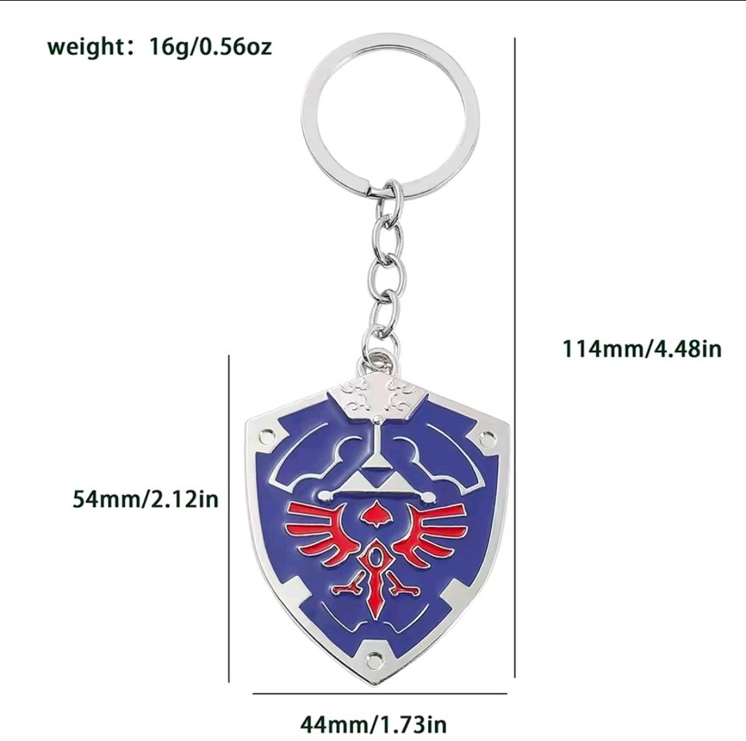 Blue metal enamel shield keychain with silver split ring and chain, red Triforce emblem