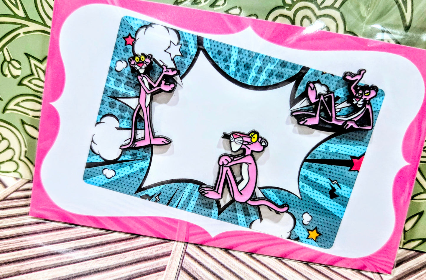 Enamel pin set of three pink-and-black cartoon cat pins in a pink-bordered window box