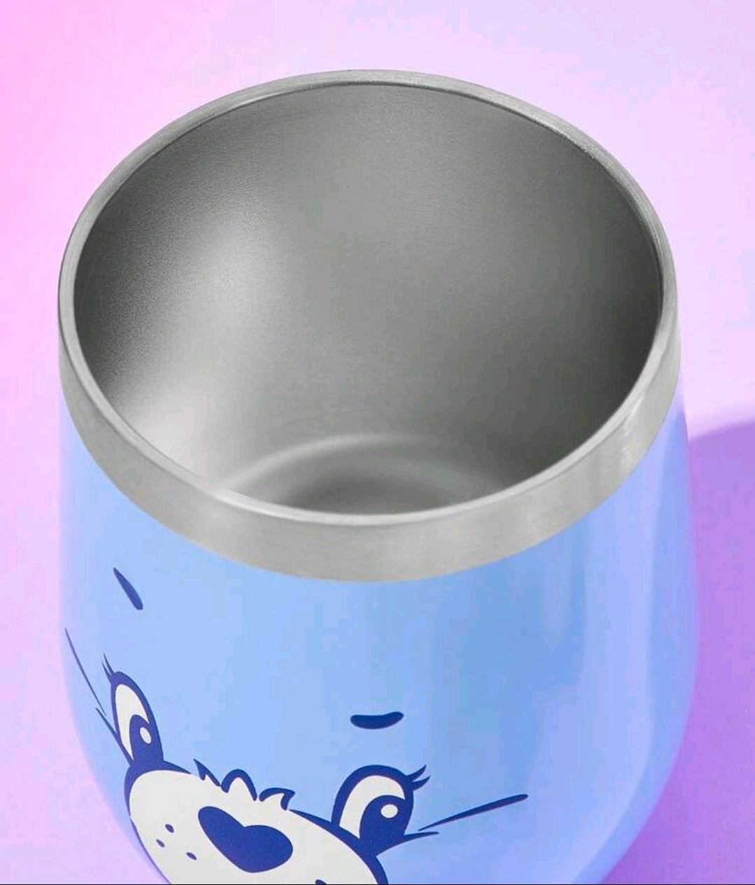 Blue stainless steel insulated tumbler with a bear face graphic