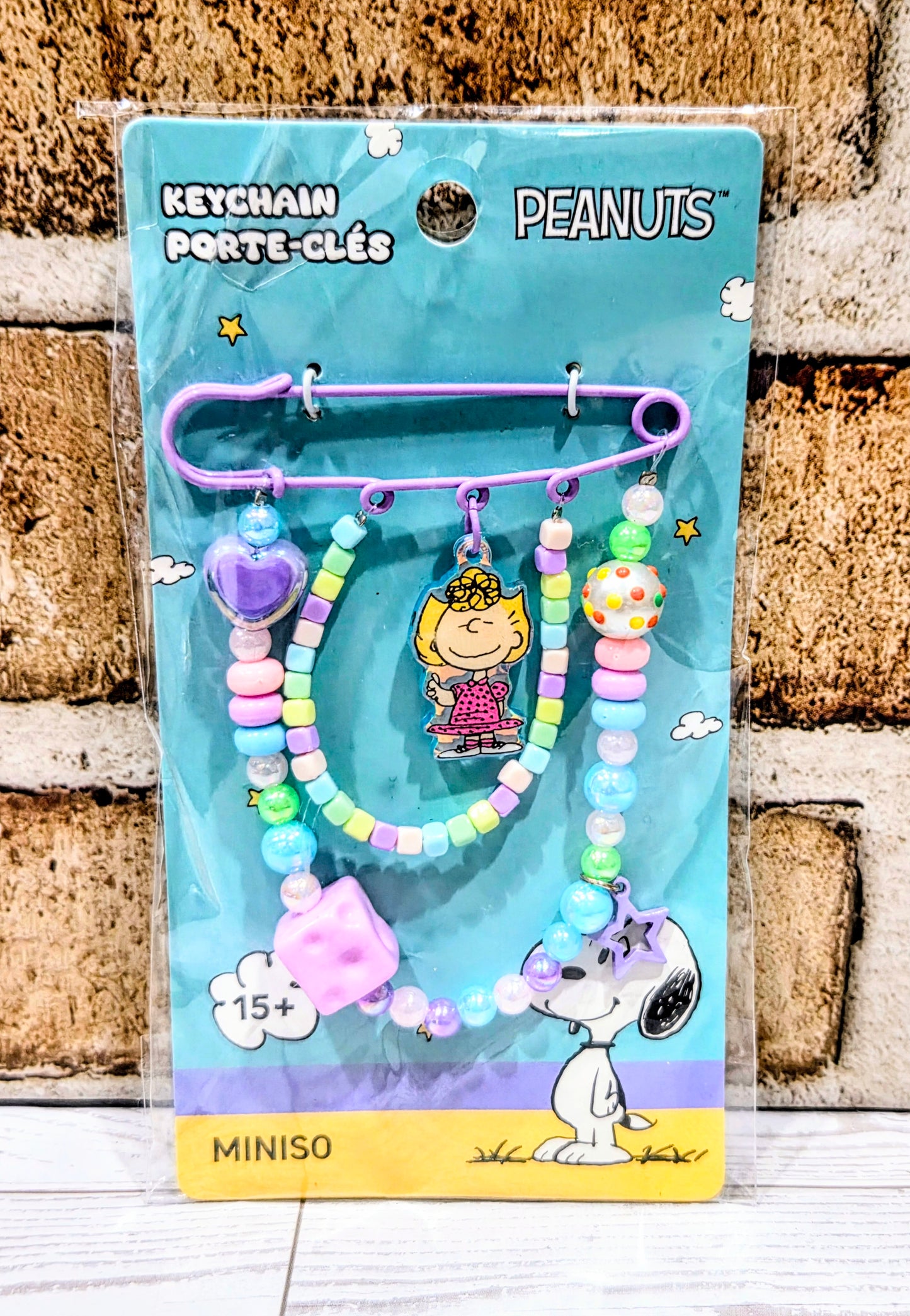 Peppermint Patty beaded safety pin keychain on card with multicolor beads and star charm