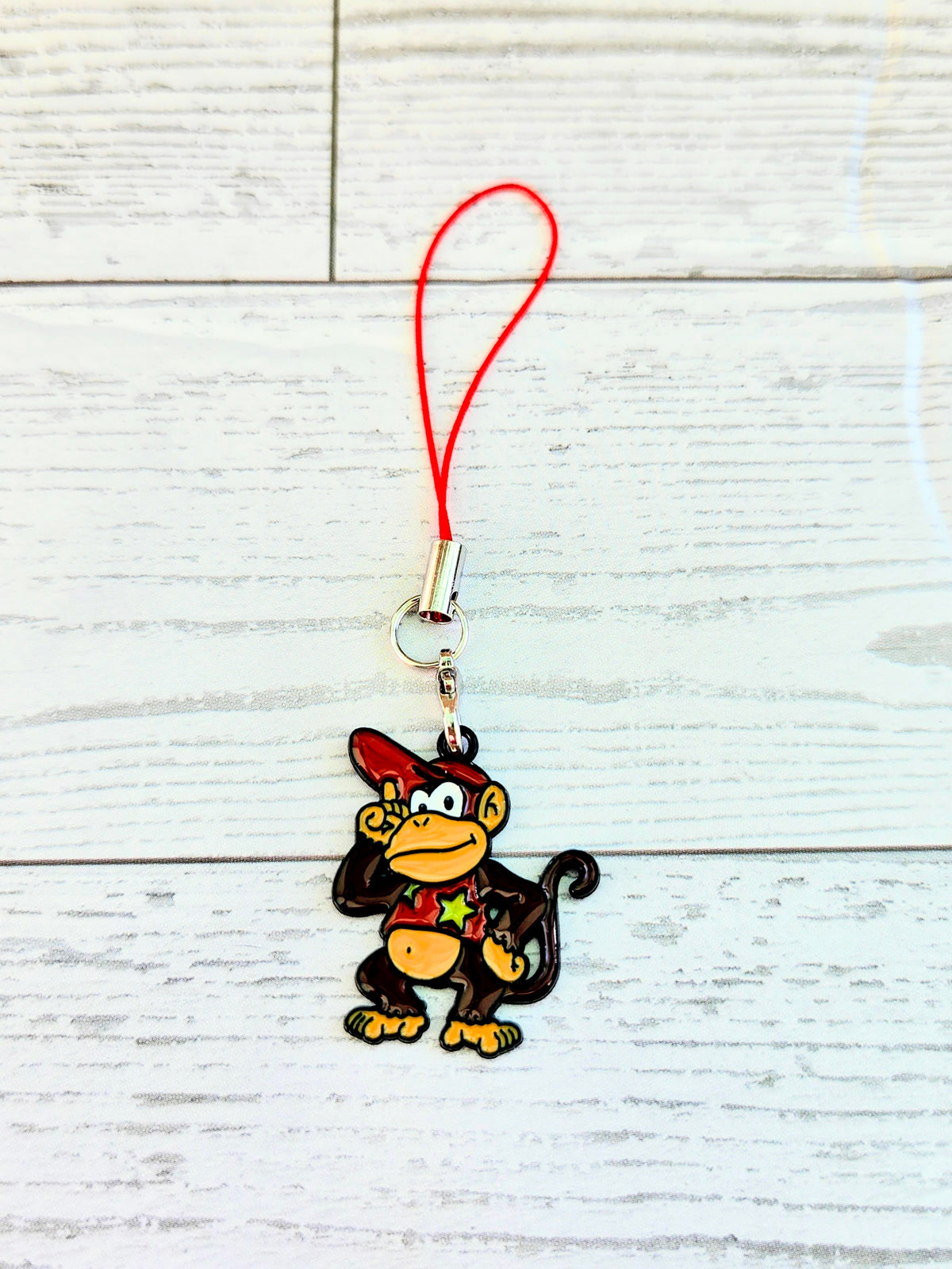 Diddy Kong enamel charm with red wrist strap and metal clasp