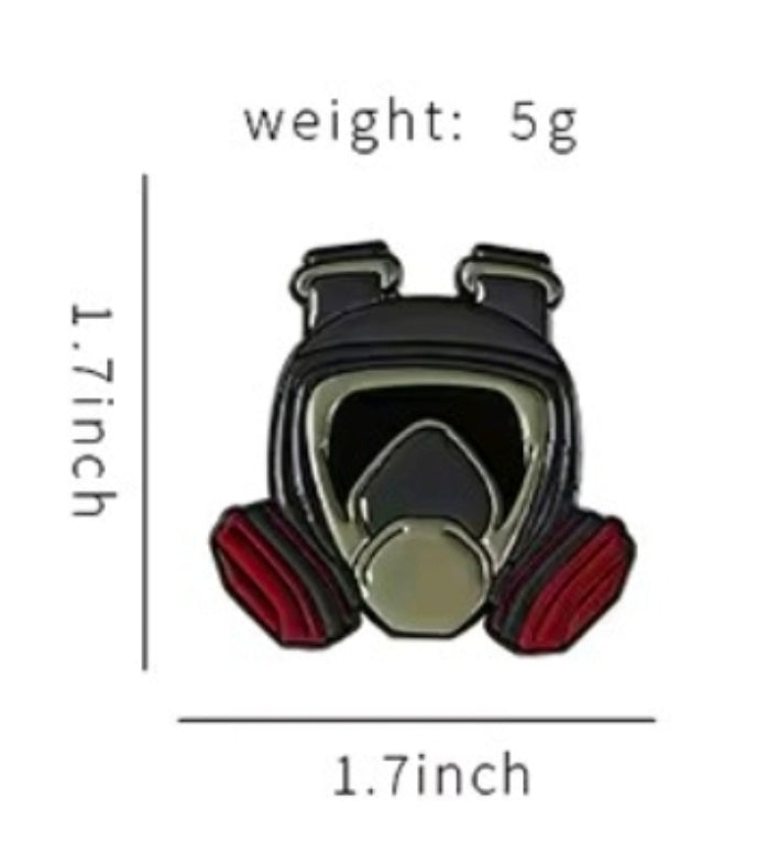 Hazmat gas mask enamel pin with black, olive, and red details
