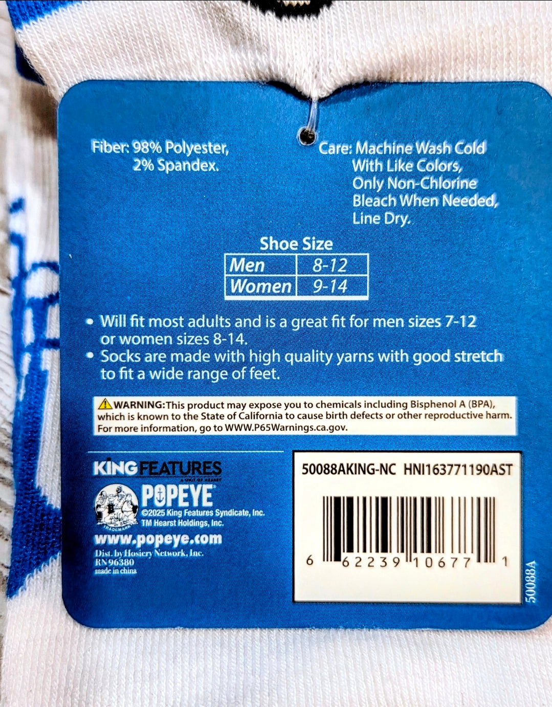 Quarter crew socks with blue-and-white ribbed cuff and size tag