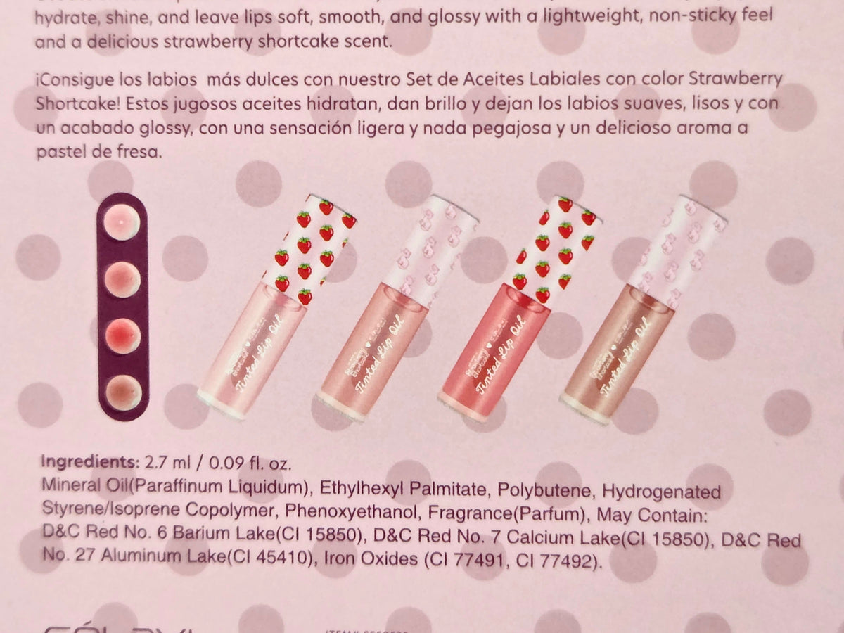 Four tinted lip oil tubes shown on a product card, set with berry-inspired theme.