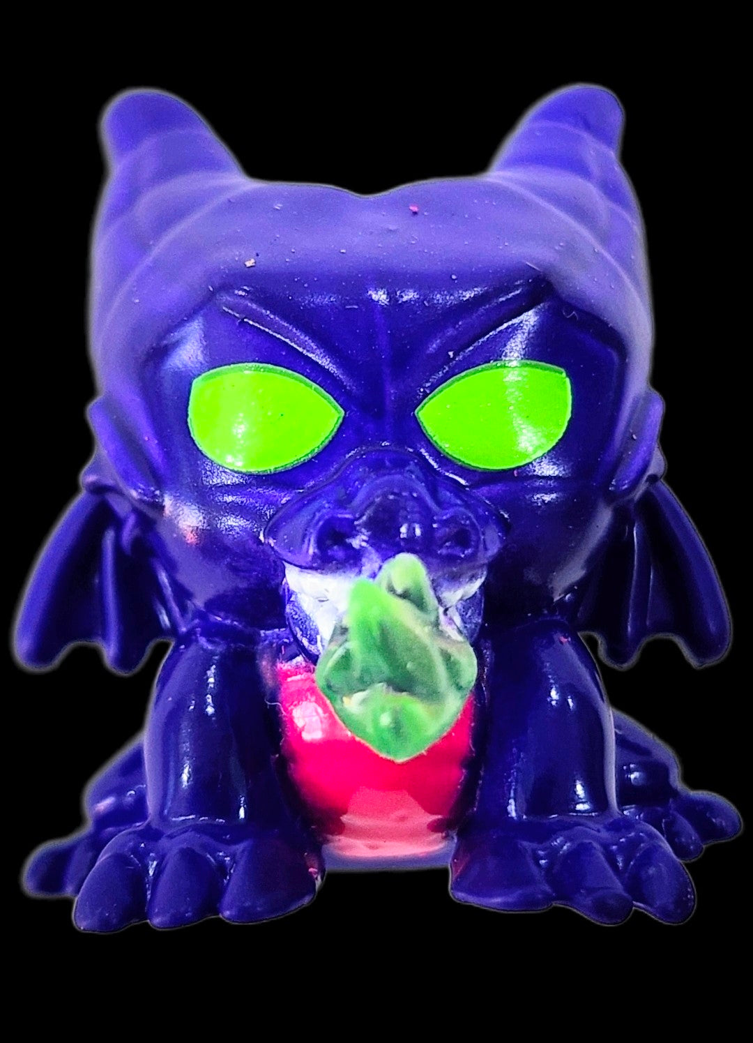 Purple dragon squish'alots figure with glowing green eyes and bat wings