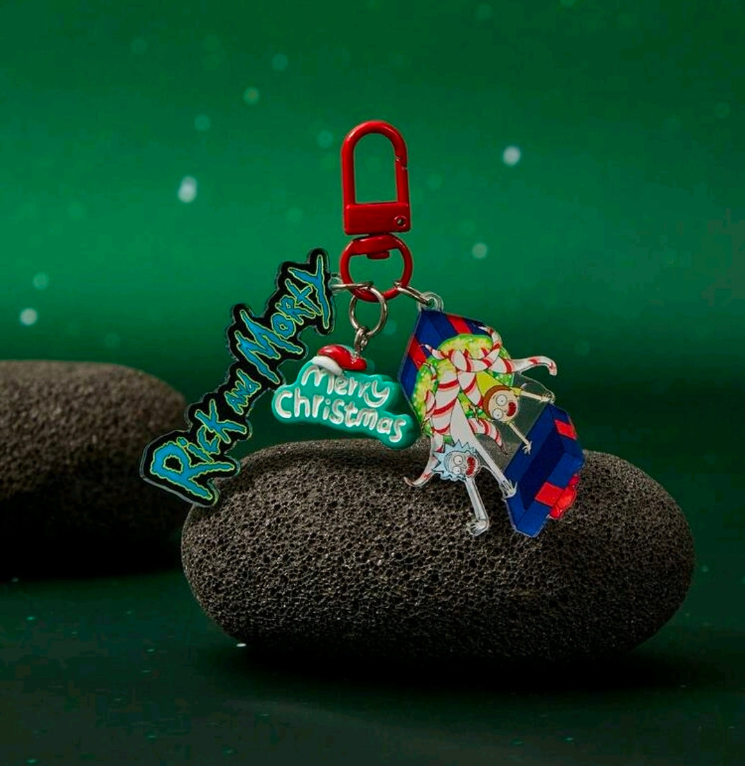 Red carabiner keyring with Rick script charm, Merry Christmas tag, and Santa elf charm