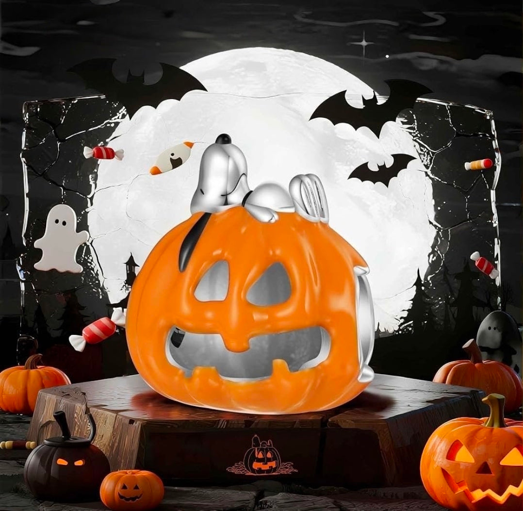 Orange jack-o'-lantern enamel S925 charm with silver dog figure sleeping on top