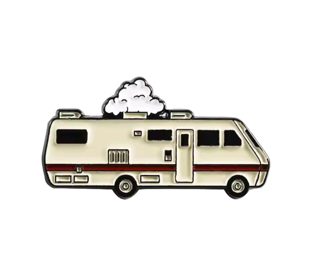 Enamel pin of white RV camper van with red stripe, black windows, and wheels