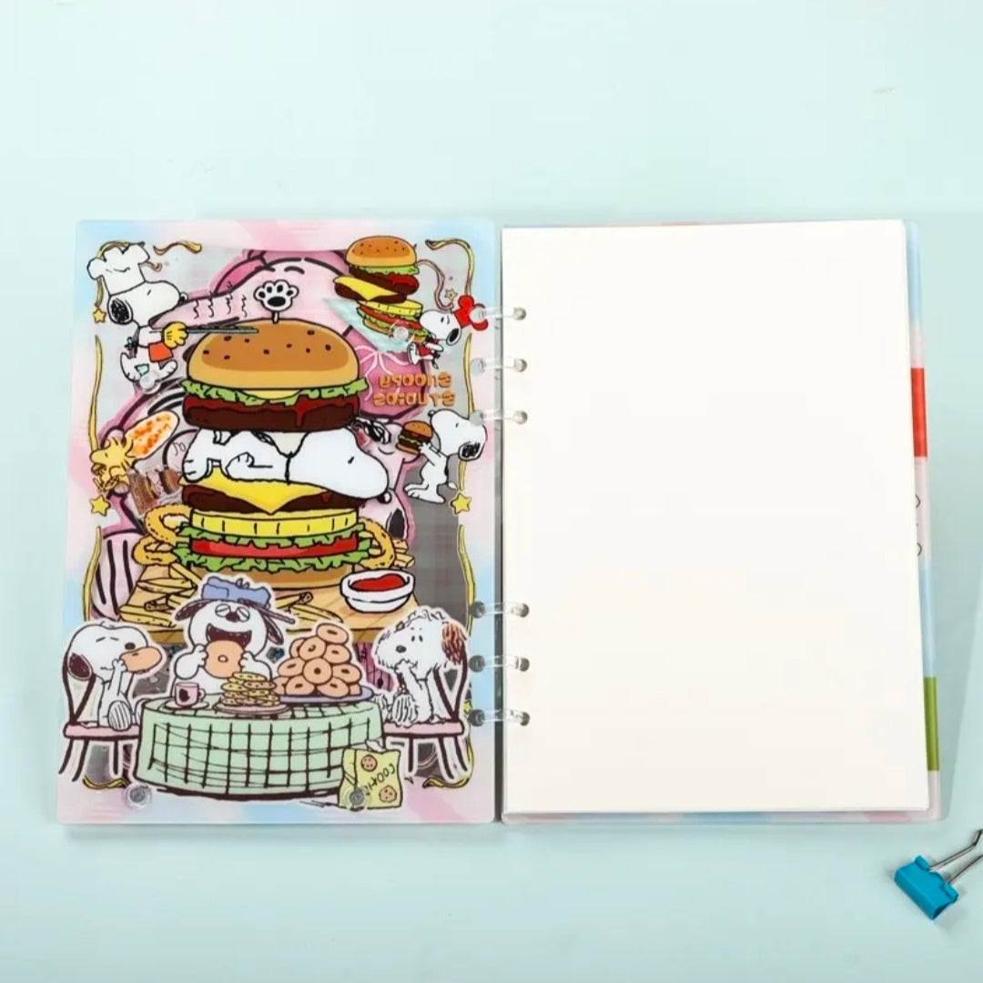 Open A5 acrylic shaker notebook with left Snoopy food illustration page and blank right page.