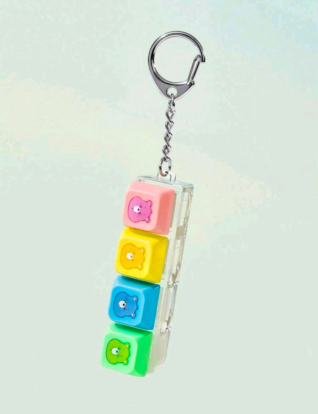 Keychain fidget with silver keyring and four multicolor blocks with bear faces