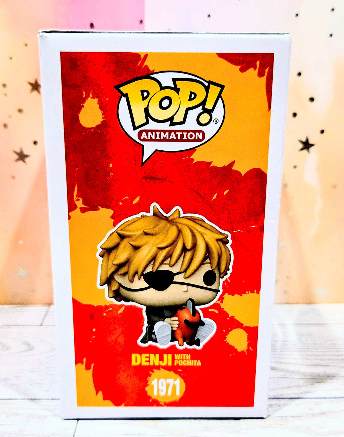 Funko Pop! Animation vinyl figure box front featuring blond-haired character holding a red chainsaw