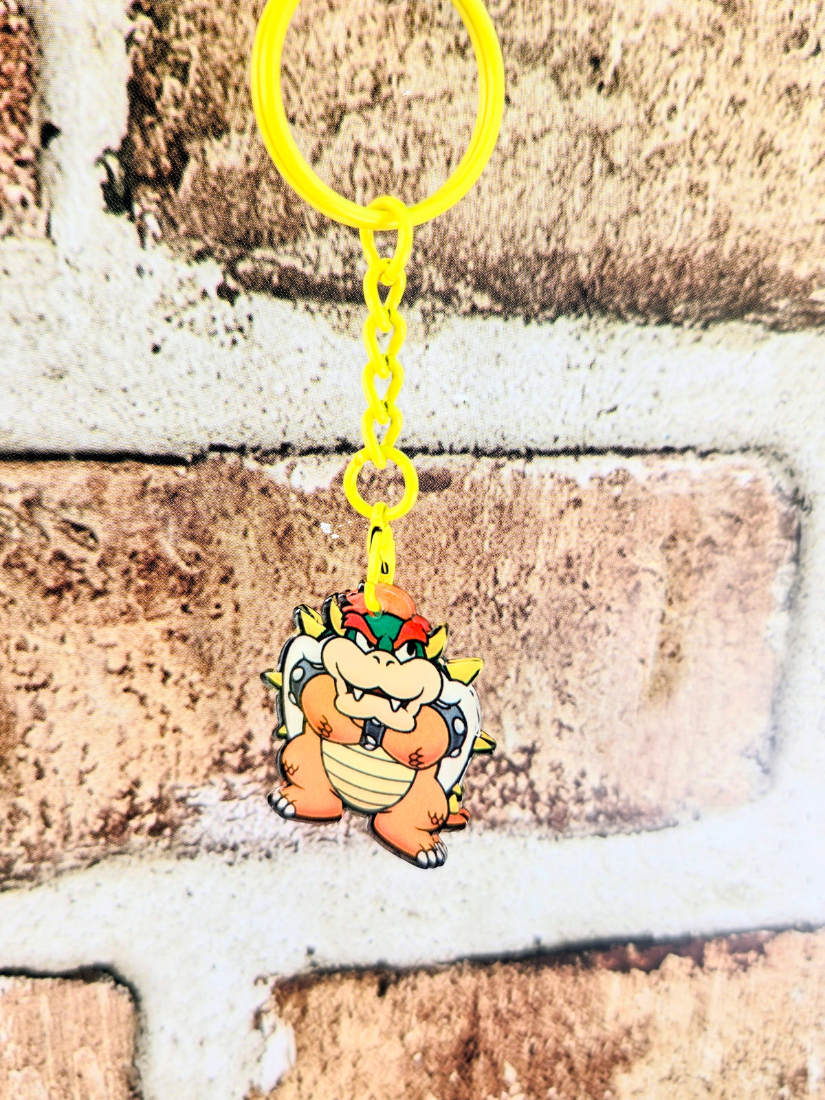 Bowser acrylic keychain with yellow ring and chain, standing character