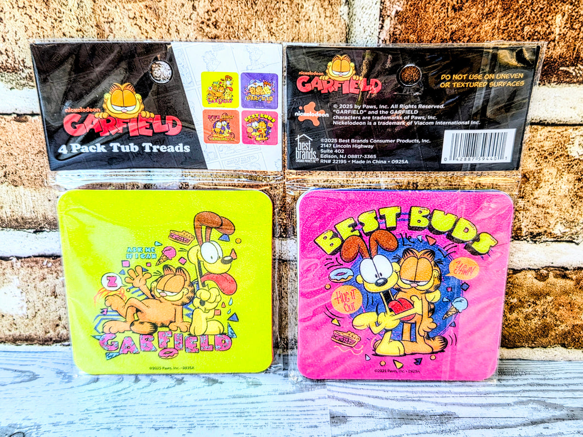 Garfield socks in lime green and bright pink, each with cartoon cat graphic and text.