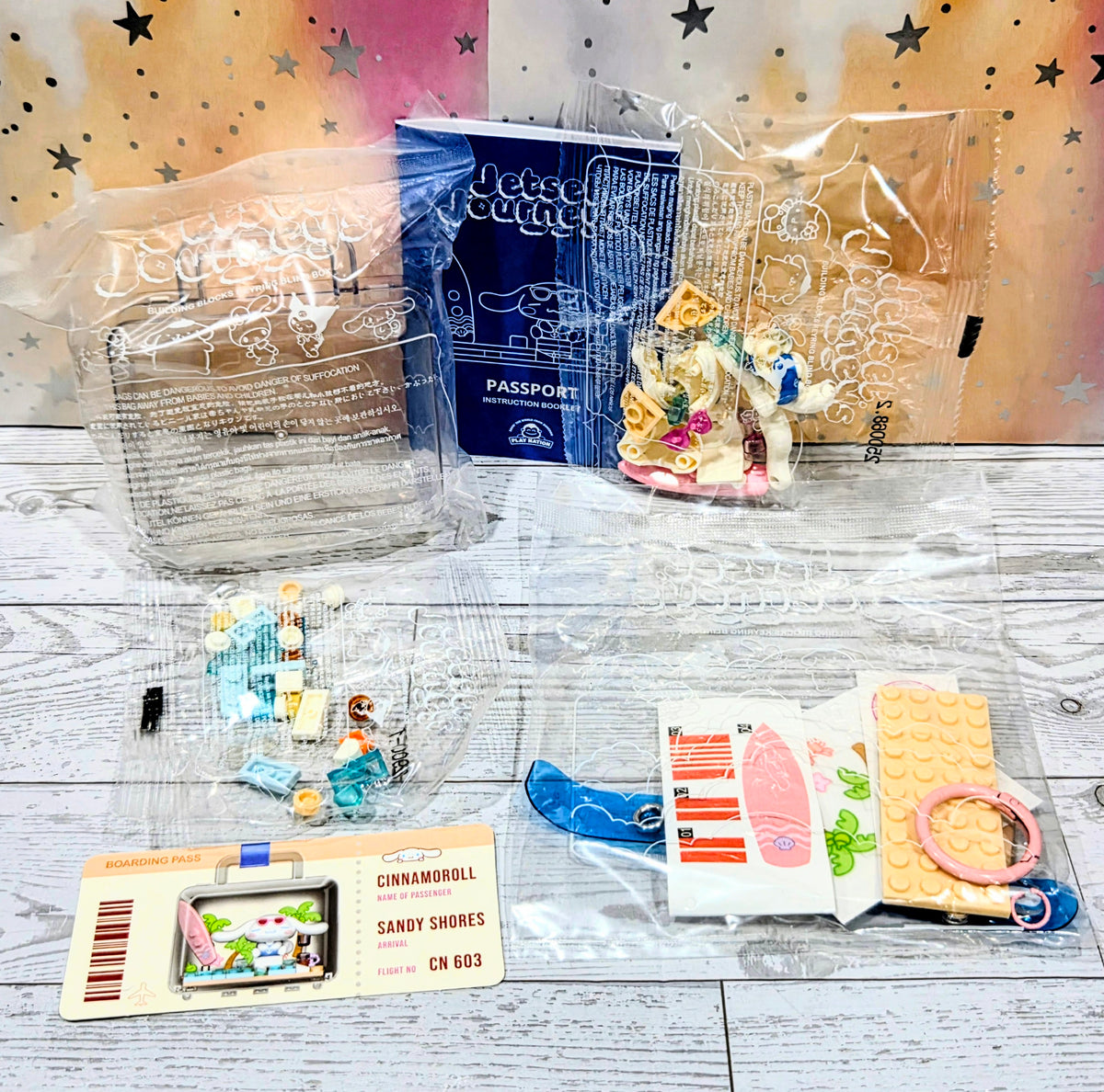 Jetset Journeys building block keychain set contents with passport card and mini parts