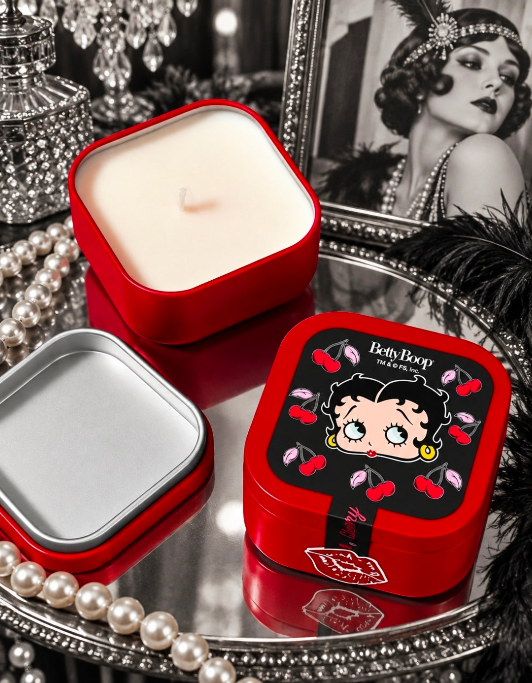 Red and silver square candle tins with Betty Boop cherry design on red lid