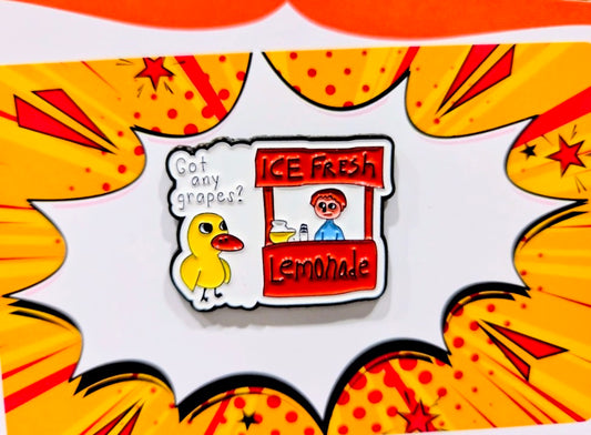 Duck and lemonade stand enamel pin with “Got any grapes?” speech bubble