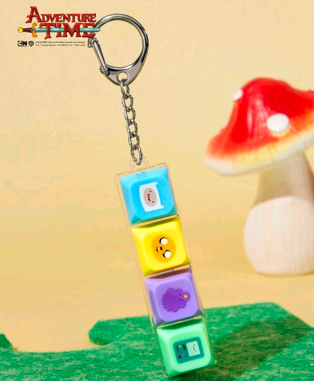 Adventure Time fidget keychain with four colored cube clickers hanging from a key ring