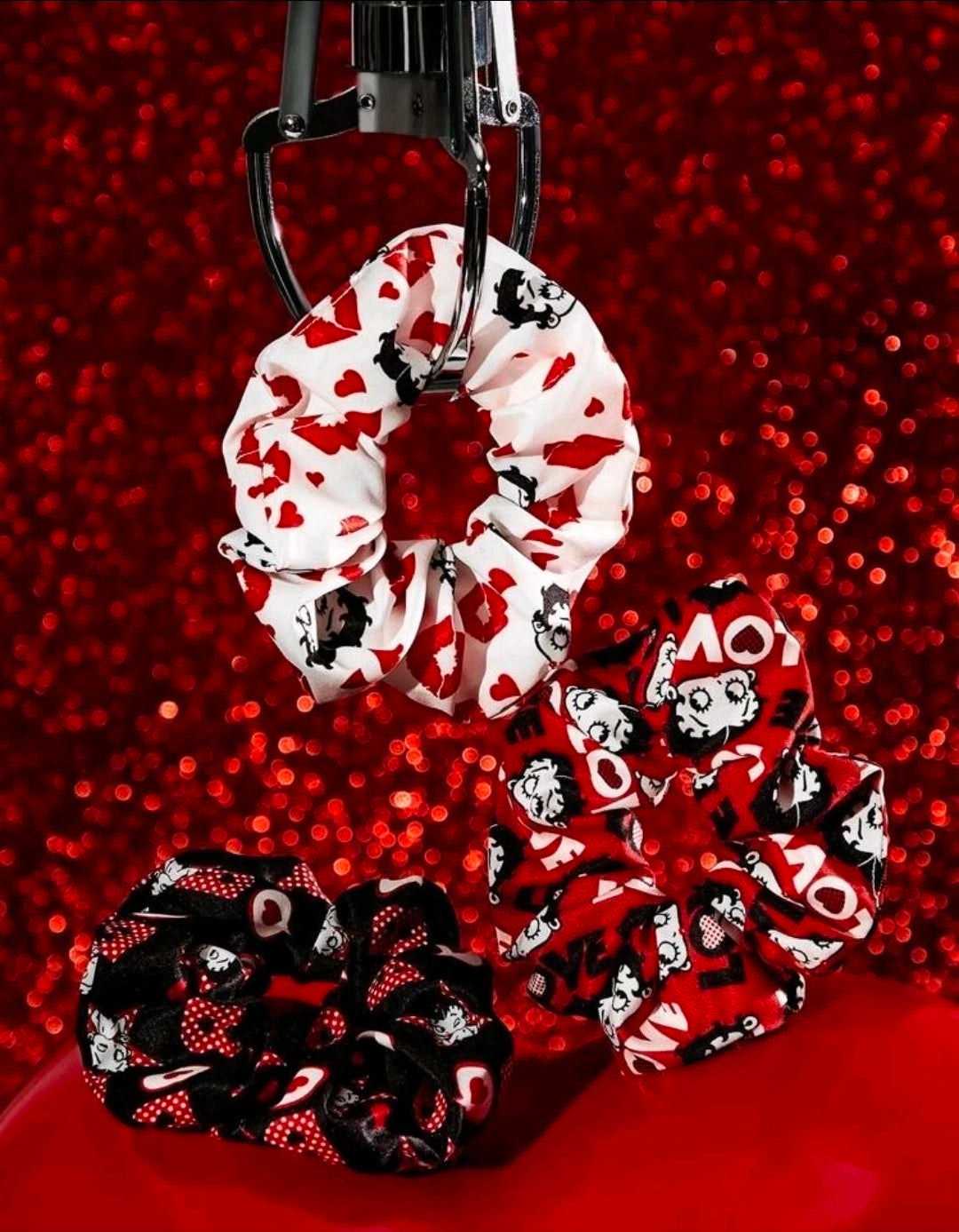 Character print hair clips in white, red, and black with heart patterns