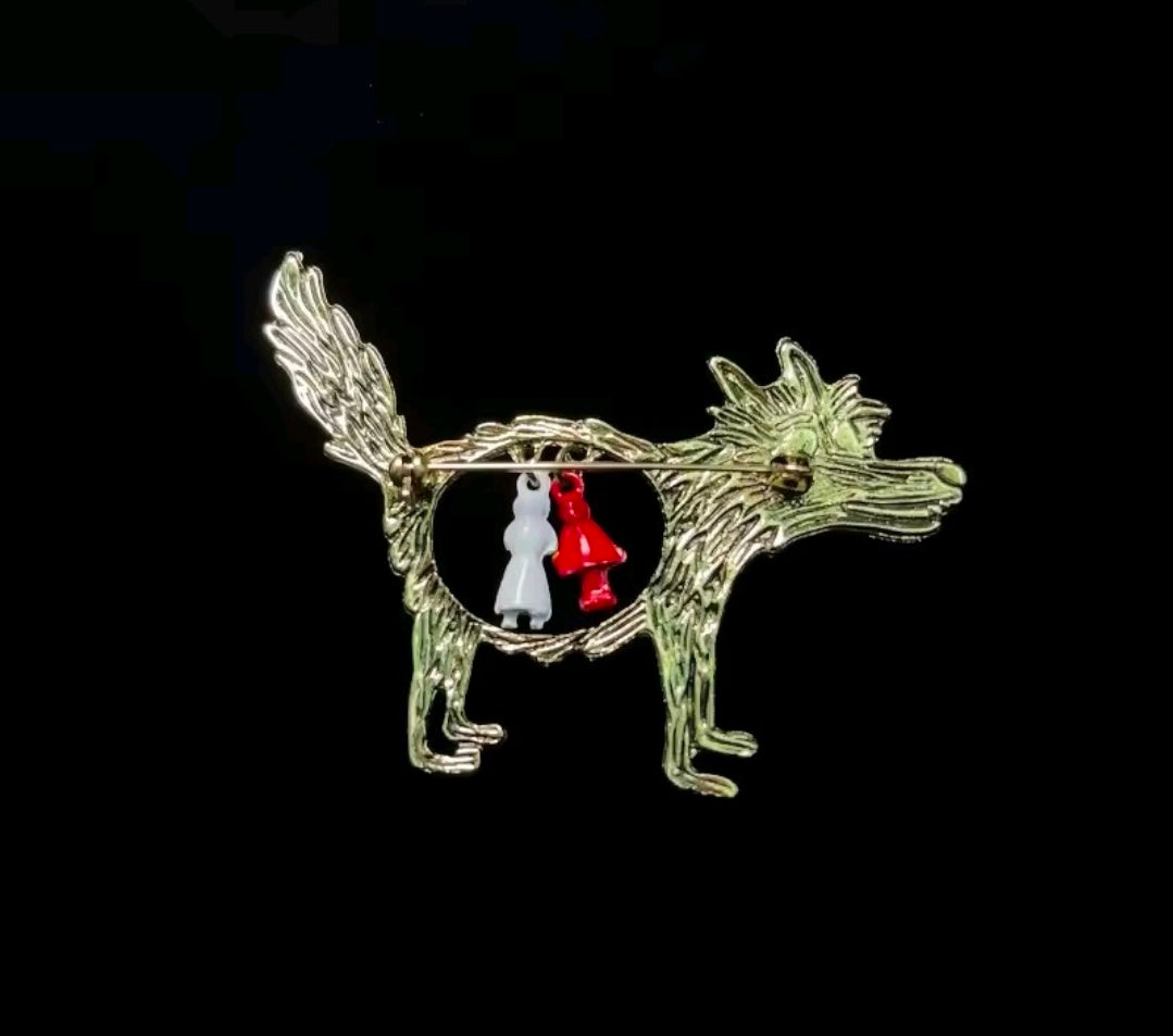 Silver-tone enamel wolf brooch pin with circular Red Riding Hood and grandma charms.