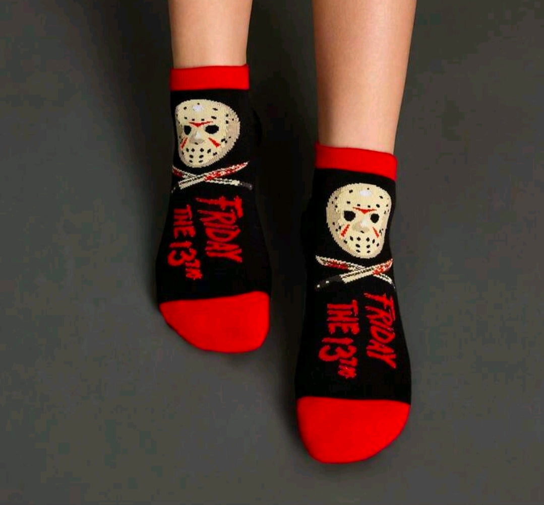 Ankle socks on legs with Jason hockey mask graphics and red “Friday the 13th” text