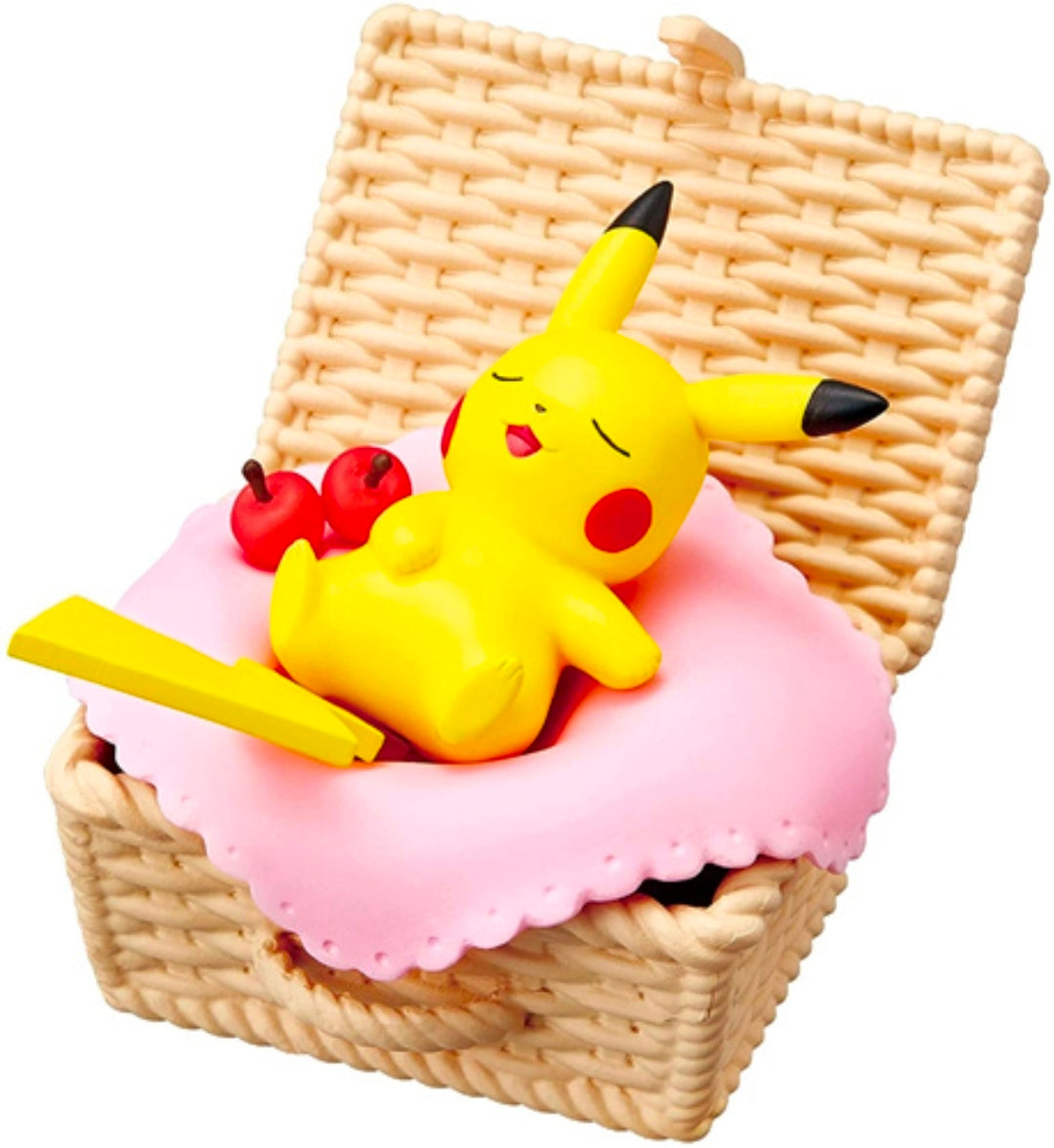 Miniature Pikachu lounging on a pink cushion with red berries in a woven basket