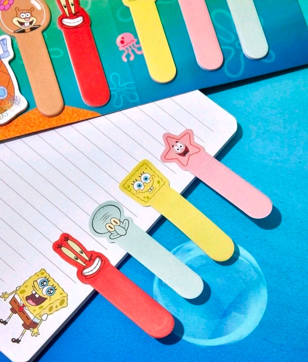 Multiple character sticky note tabs attached to a lined notepad page