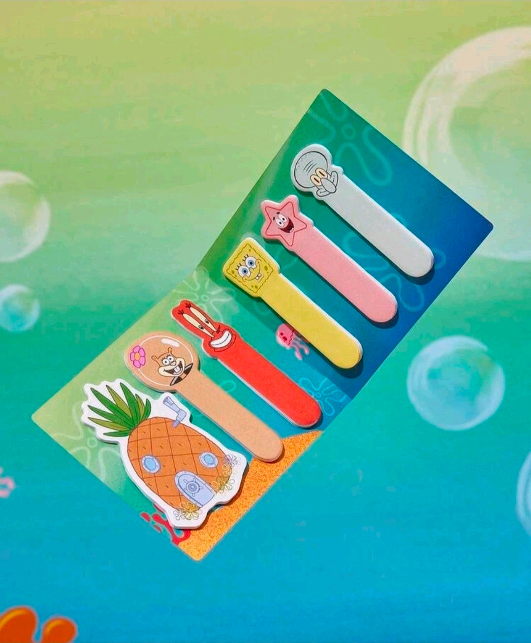 Assorted character sticky note tabs in a blister pack with blue bubbles