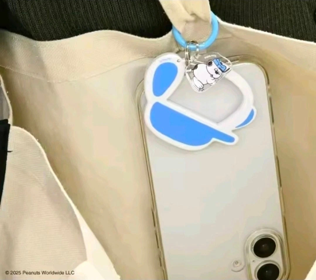 Snoopy carabiner charm on phone case with white body and blue accents
