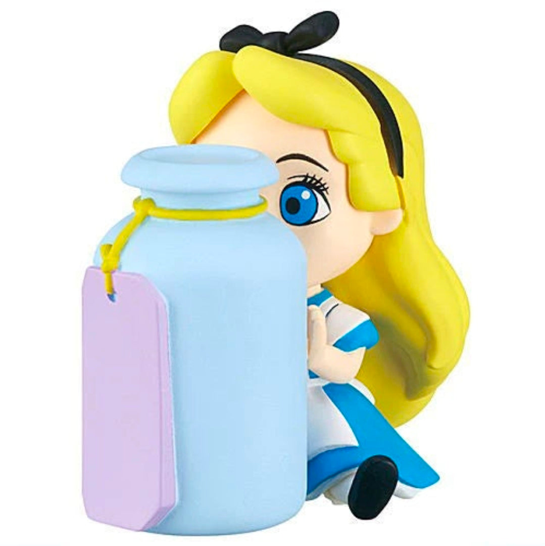 Yellow-haired girl gashapon figure holding a blue teapot and purple pouch