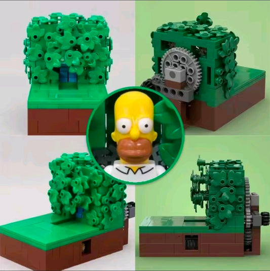 Brick playset with dark green foliage, brown base, and Homer-style minifigure in circular opening.