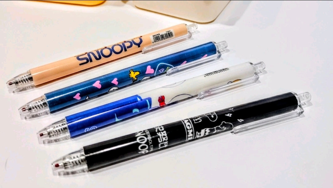 Snoopy-themed pens set with blue and black patterned barrels