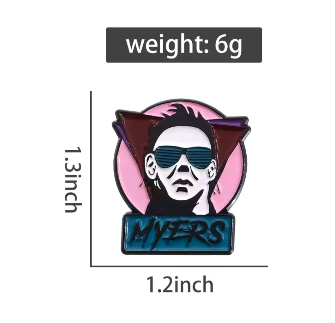 Enamel pin featuring Michael Myers head with blue sunglasses and "MYERS" text