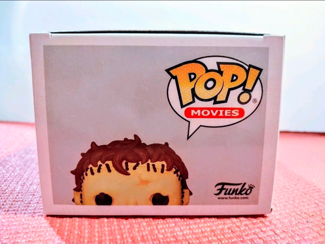 Vinyl figure in box with Funko Pop! Movies logo and partial character face