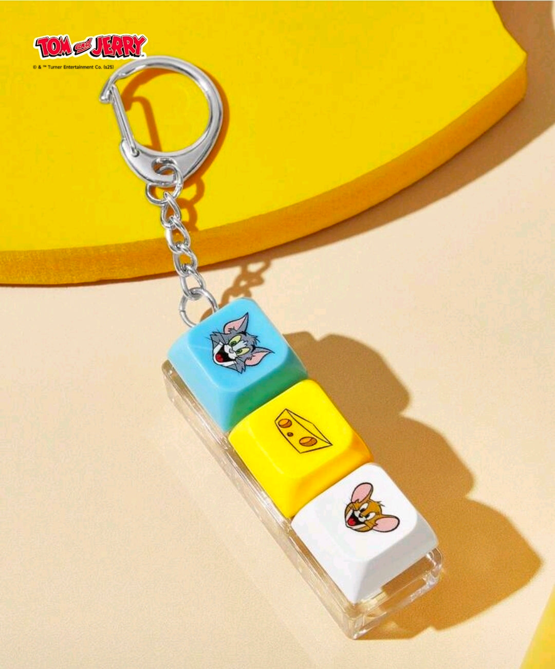Keychain fidget clicker with blue, yellow, and white stacked blocks on chain
