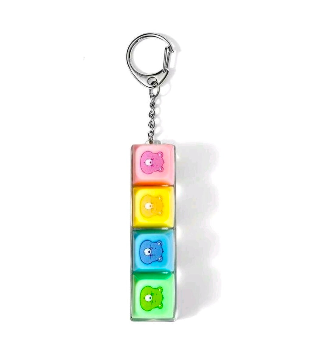 Keychain fidget with four stacked colored blocks and bear faces in a clear case