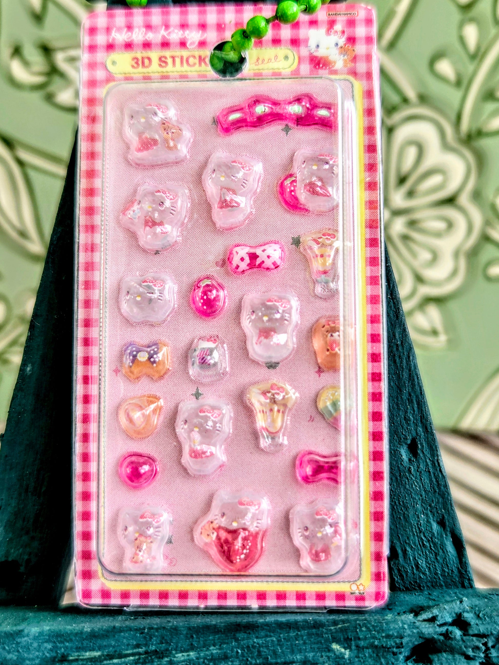 Pink blister pack of 3D character stickers with a beaded hanging keychain loop