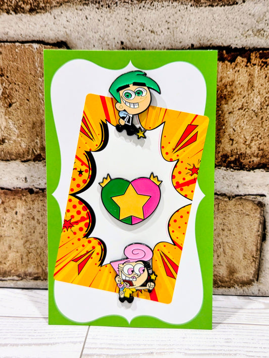 Enamel pin set card showing three cartoon pins: Timmy, star-heart, and pink Wanda.