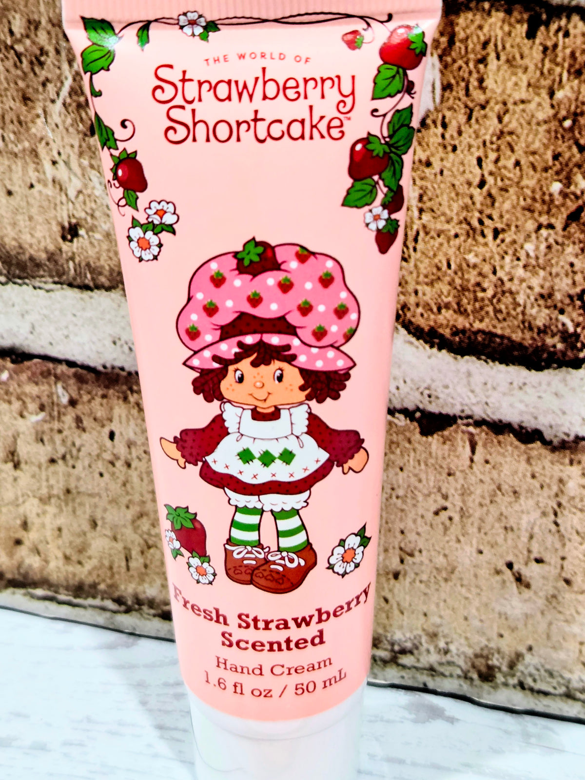 Strawberry Shortcake hand cream tube labeled Fresh Strawberry scented with strawberry pattern